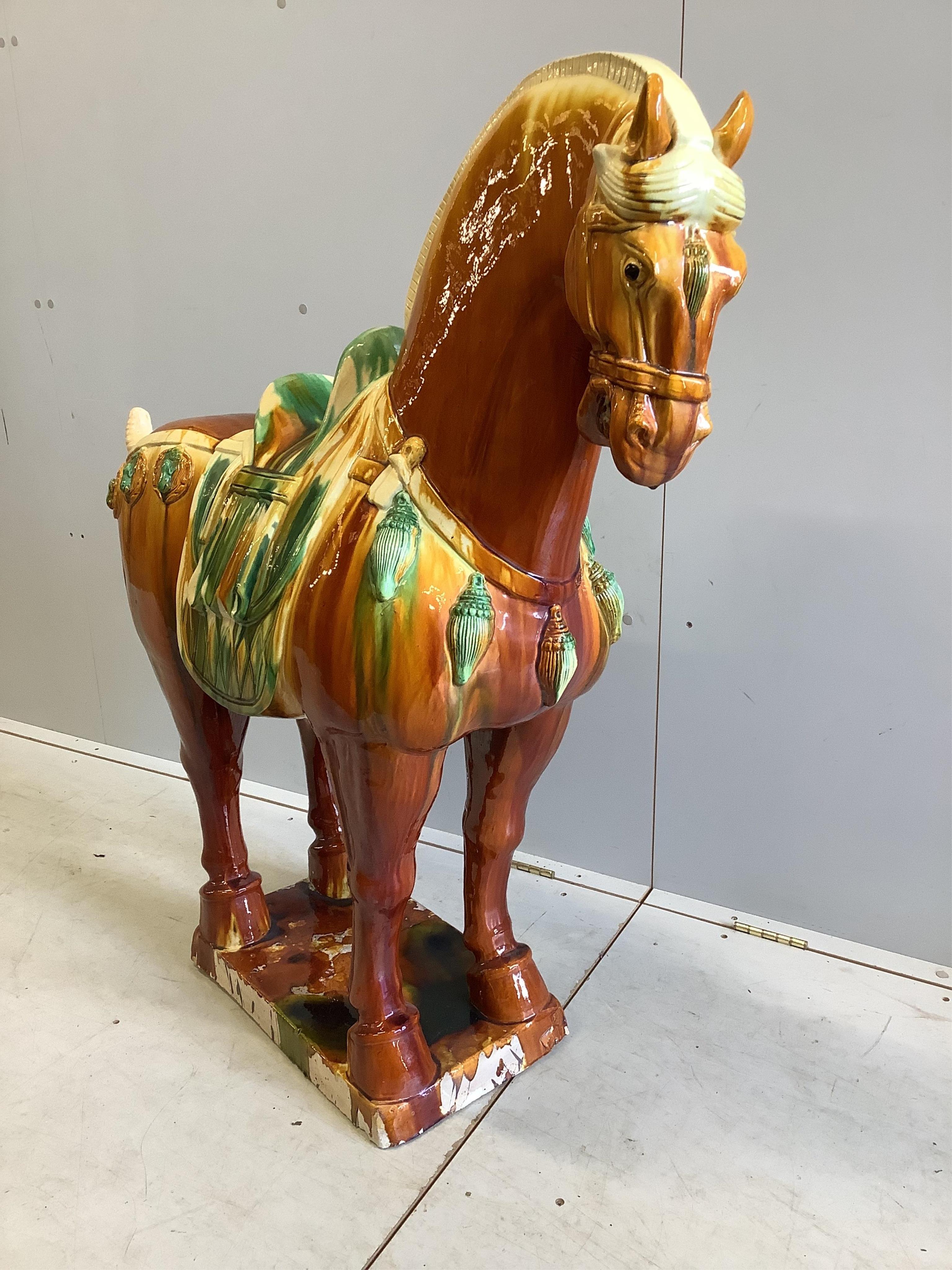 A large modern glazed earthenware Tang style horse, height 114cm. Condition - fair
